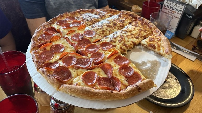a large half plain, half pepperoni pizza