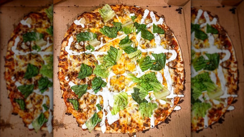 a large taco pizza in takeout box from Ronnally's Pizza & Pasta