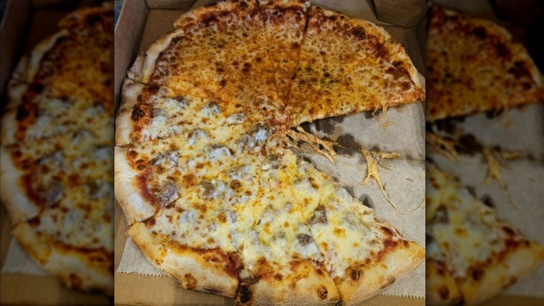 large half cheese, half sausage pizza in takeout box from Pizza-A-Go-Go in Missouri