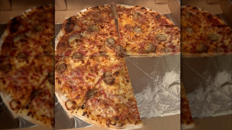 a large sausage and pepper pizza in takeout box from Piezon's Pizzeria in Nebraska