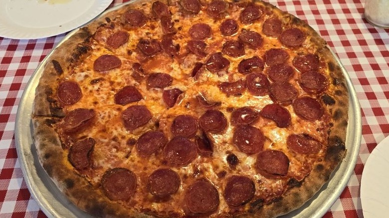 a 15 inch pepperoni pizza on metal pizza tray at Giovanni's Pizzeria in New Mexico