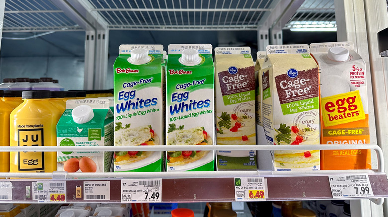 assorted brands of liquid eggs in grocery store