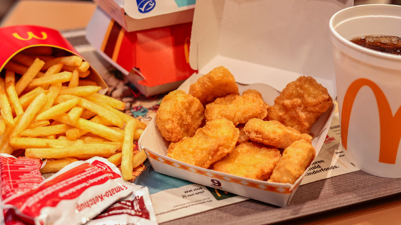 McDonald's nugget meal with fries and drink on tray