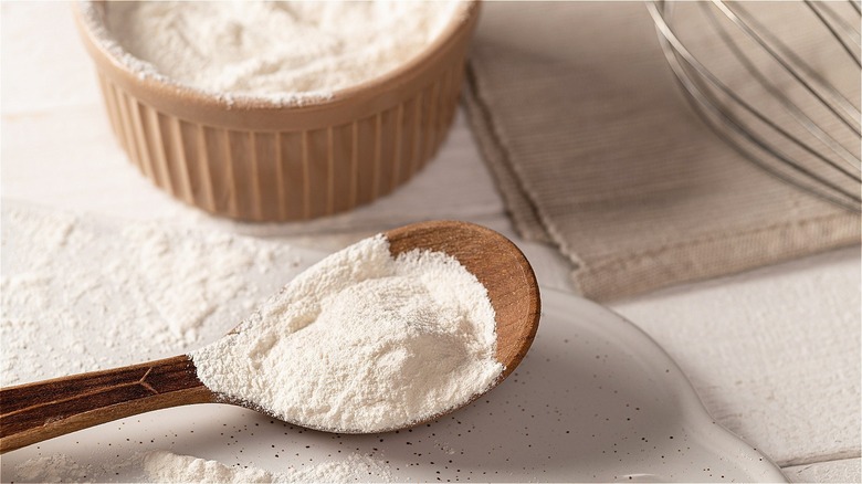 Baking powder in a wooden spoon