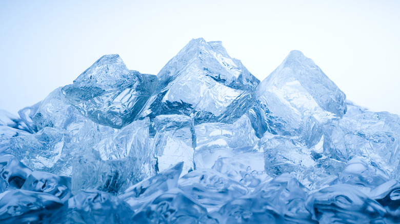 Blue ice cubes on a white background