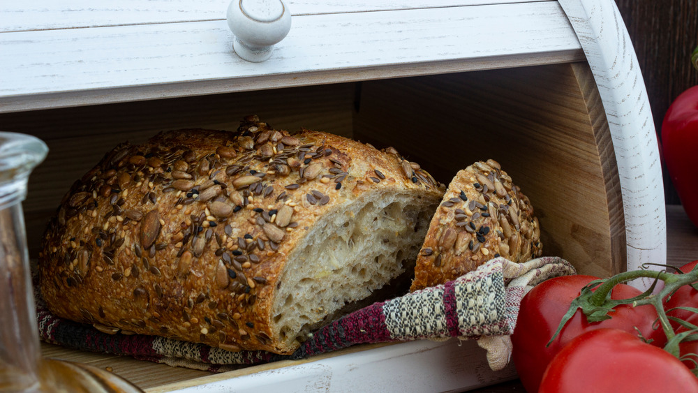 A bread box with bread in it