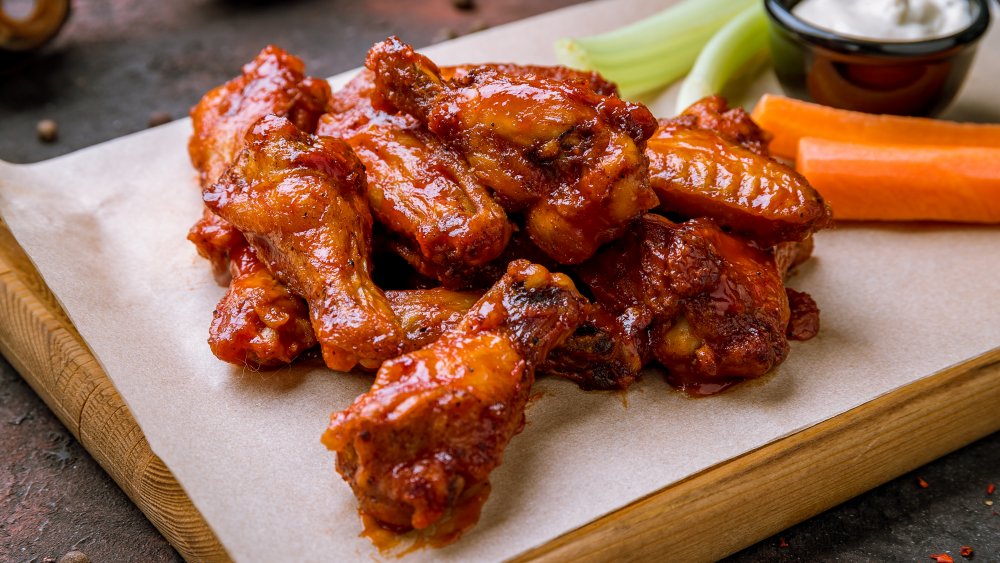 chicken wings on platter with celery and carrots