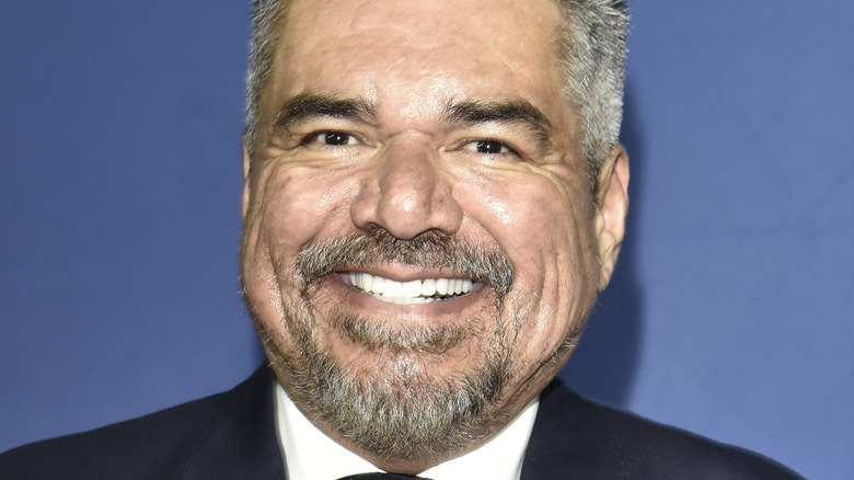 George Lopez smiling on red carpet