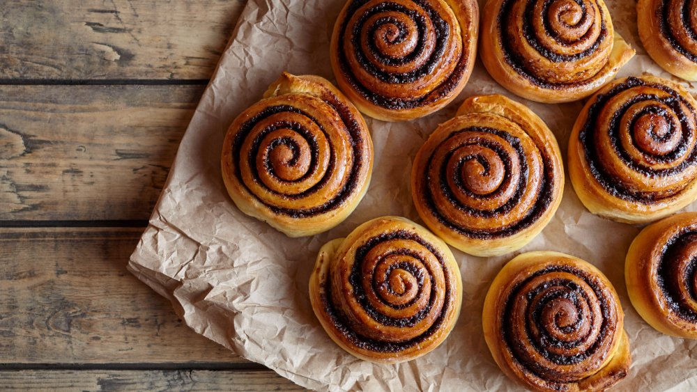 cinnamon rolls on parchment paper