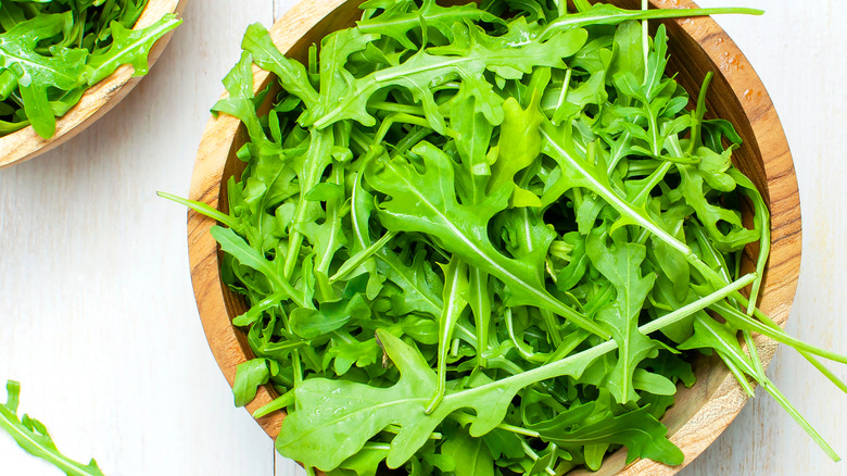 Arugula in a wooden bowl