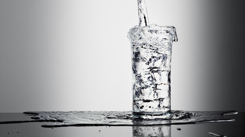 a glass of water being filled 