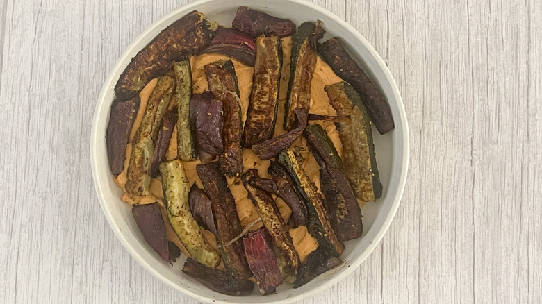 roasted zucchini on top of hummus