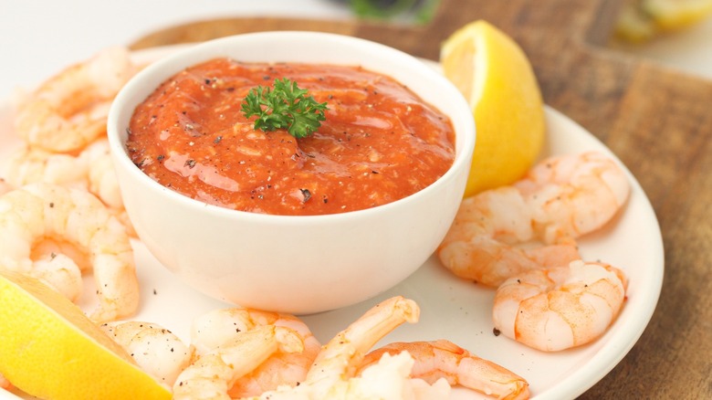 cocktail sauce with shrimp and lemons
